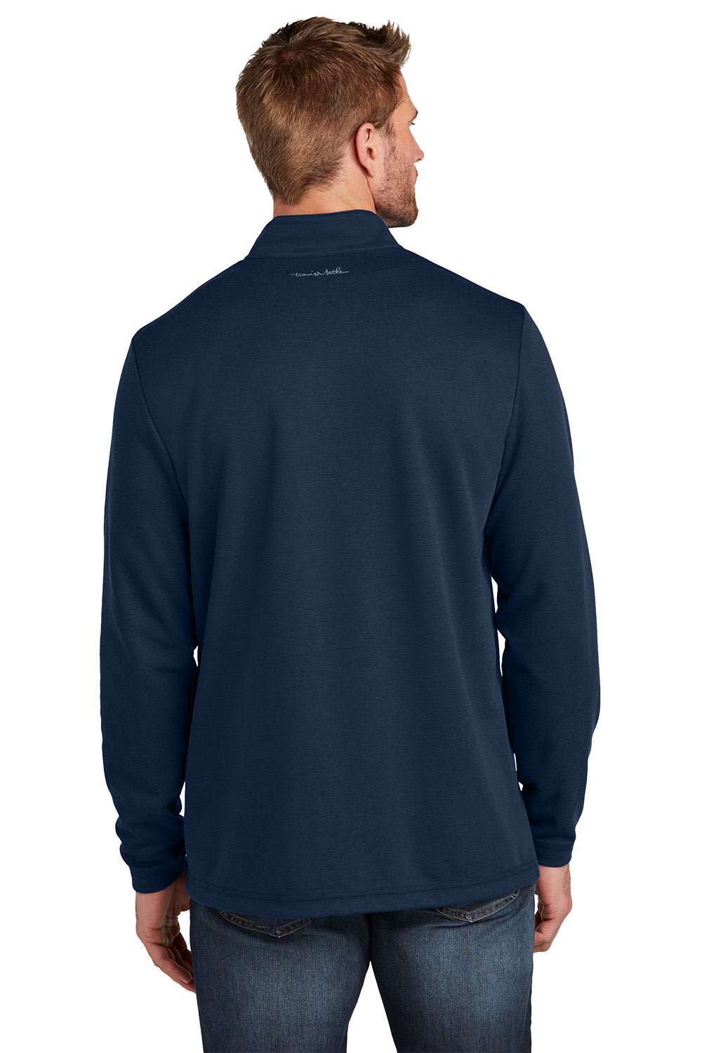 Man wearing a navy long-sleeve shirt with a visible brand logo on the back against a white background TravisMathew Coveside 1/4-Zip, Embroidered