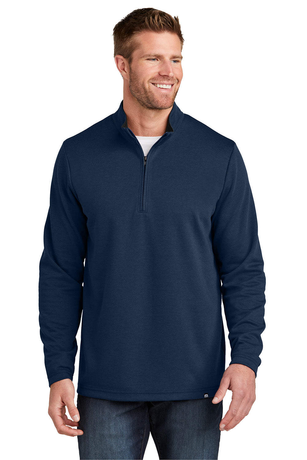 Man wearing a navy blue pullover with a white background TravisMathew Coveside 1/4-Zip, Embroidered