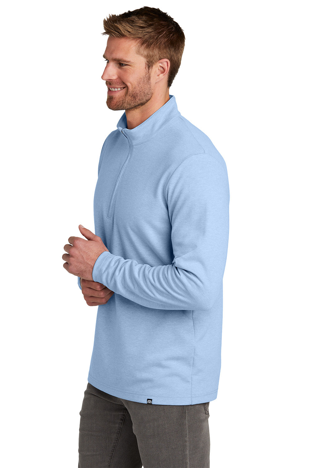 Man wearing a light blue pullover with a white background TravisMathew Coveside 1/4-Zip, Embroidered