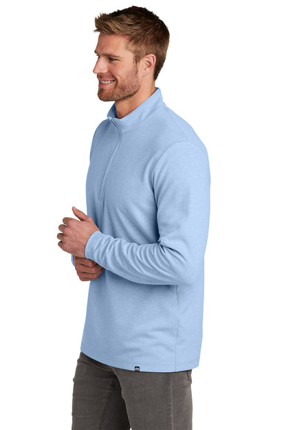Man wearing a light blue pullover with a white background TravisMathew Coveside 1/4-Zip, Embroidered