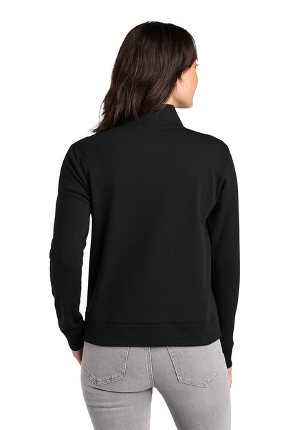 Woman wearing a black long-sleeve shirt on a white background. TravisMathew Women's Ocean Villa 1/4-Zip, Embroidered