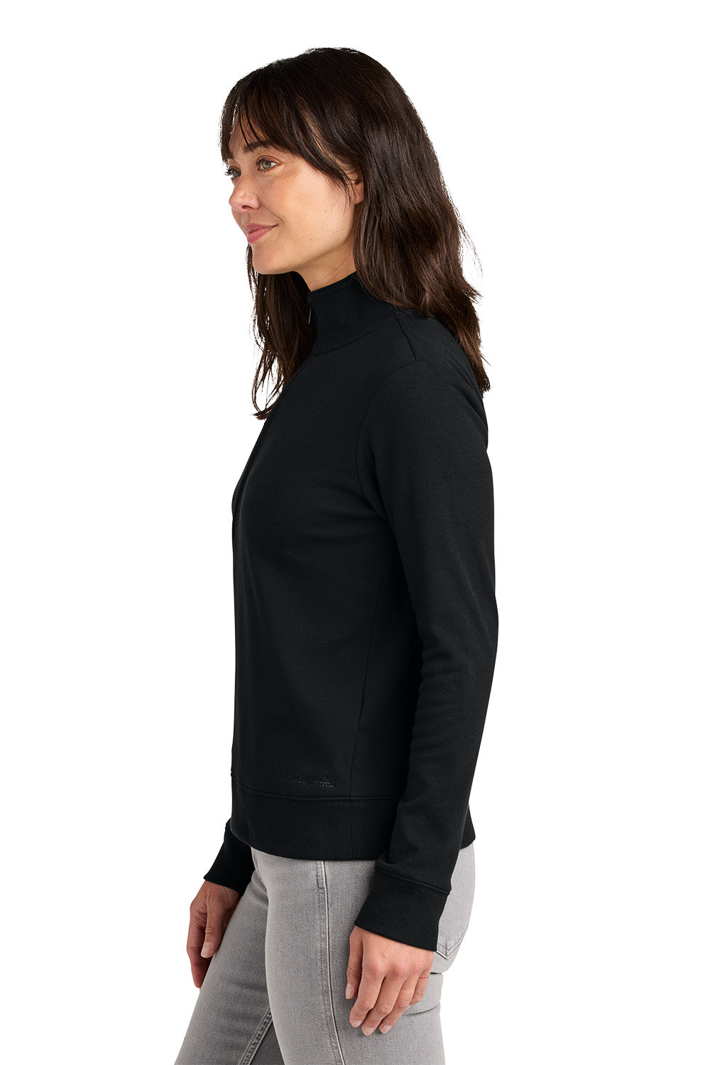 Woman wearing a black long-sleeve top on a white background. TravisMathew Women's Ocean Villa 1/4-Zip, Embroidered