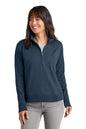 Woman wearing a blue pullover with a white background. TravisMathew Women's Ocean Villa 1/4-Zip, Embroidered