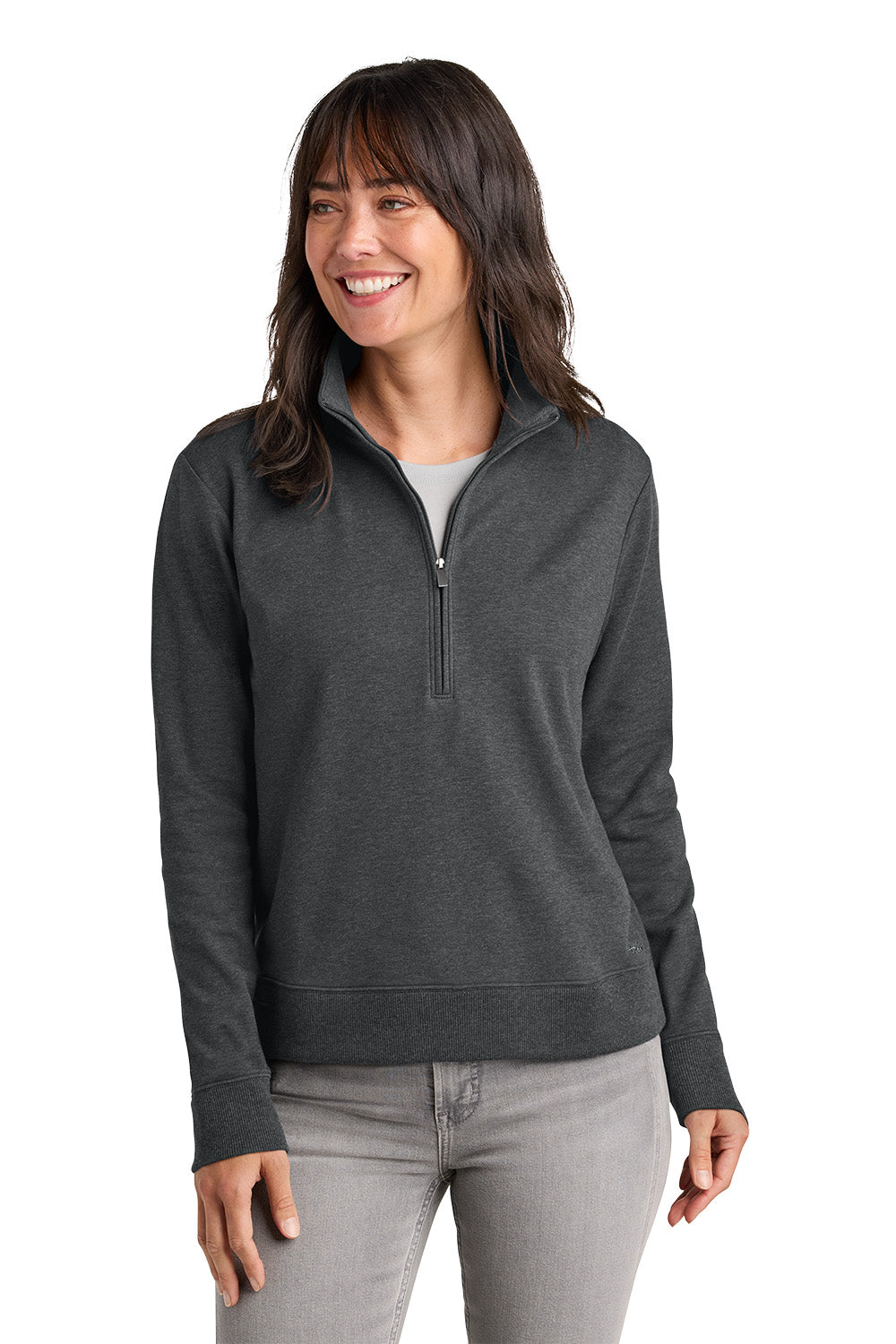 Woman wearing a dark gray pullover with a quarter zip on a white background. TravisMathew Women's Ocean Villa 1/4-Zip, Embroidered