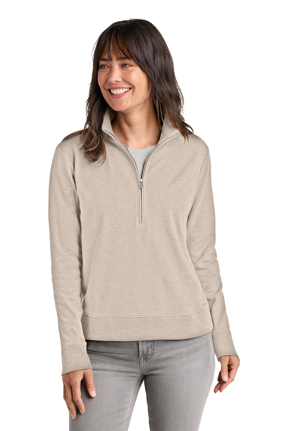 Woman wearing a beige half-zip pullover on a white background. TravisMathew Women's Ocean Villa 1/4-Zip, Embroidered