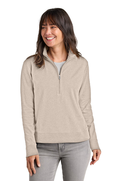 Woman wearing a beige half-zip pullover on a white background. TravisMathew Women's Ocean Villa 1/4-Zip, Embroidered