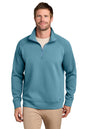 A man wearing a teal blue quarter-zip pullover sweater over a beige undershirt and khaki pants, photographed against a solid white background. TravisMathew Momentum Shift 1/4-Zip, Embroidered
