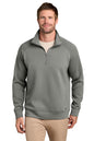A man wearing a gray quarter-zip pullover sweater over a beige undershirt and khaki pants, photographed against a plain white background. TravisMathew Momentum Shift 1/4-Zip, Embroidered