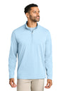 Man wearing a light blue pullover with a quarter zip on a white background. TravisMathew Onward 1/2-Zip, Embroidered