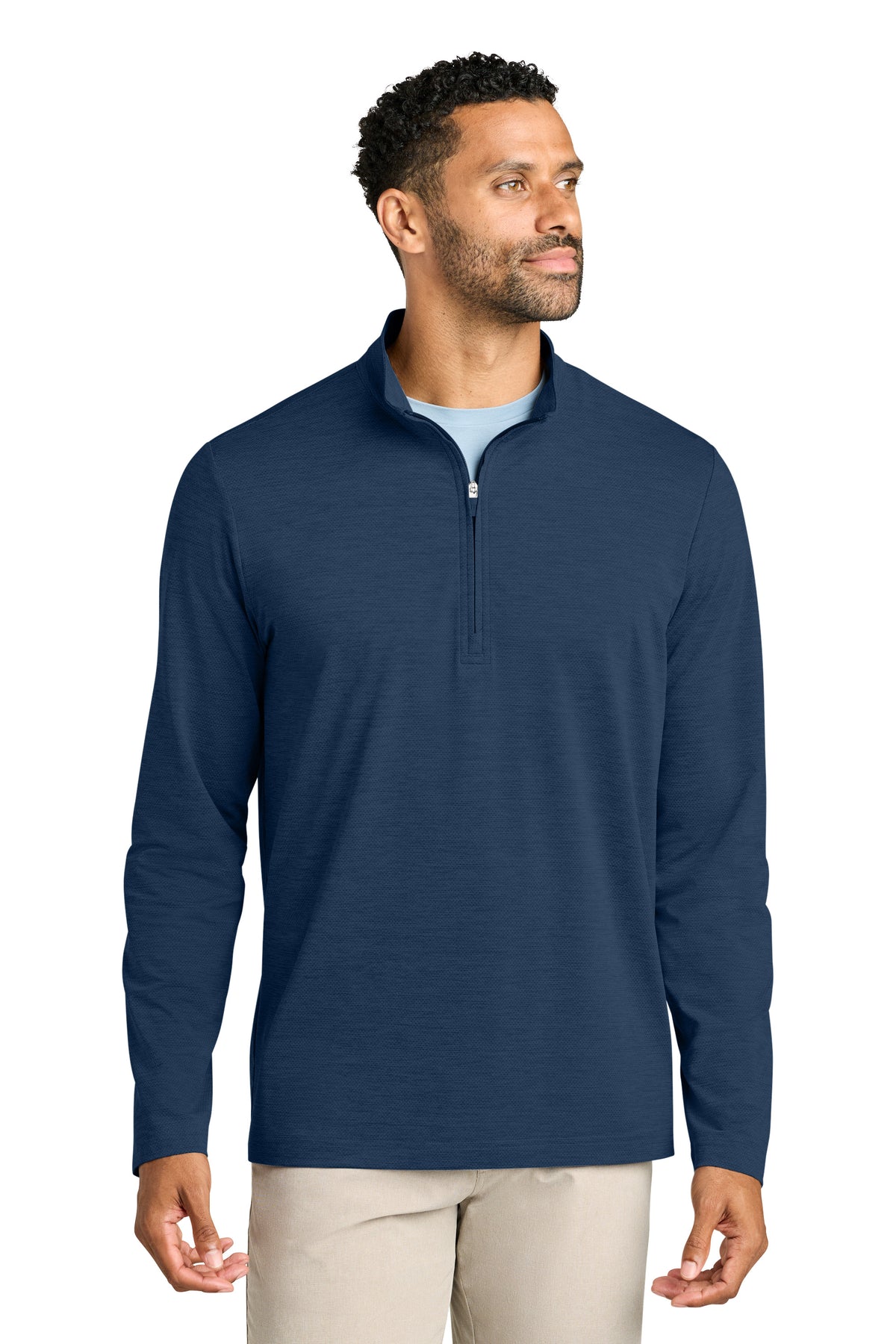 Man wearing a navy blue quarter-zip pullover on a white background. TravisMathew Onward 1/2-Zip, Embroidered