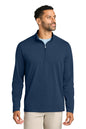 Man wearing a navy blue quarter-zip pullover on a white background. TravisMathew Onward 1/2-Zip, Embroidered