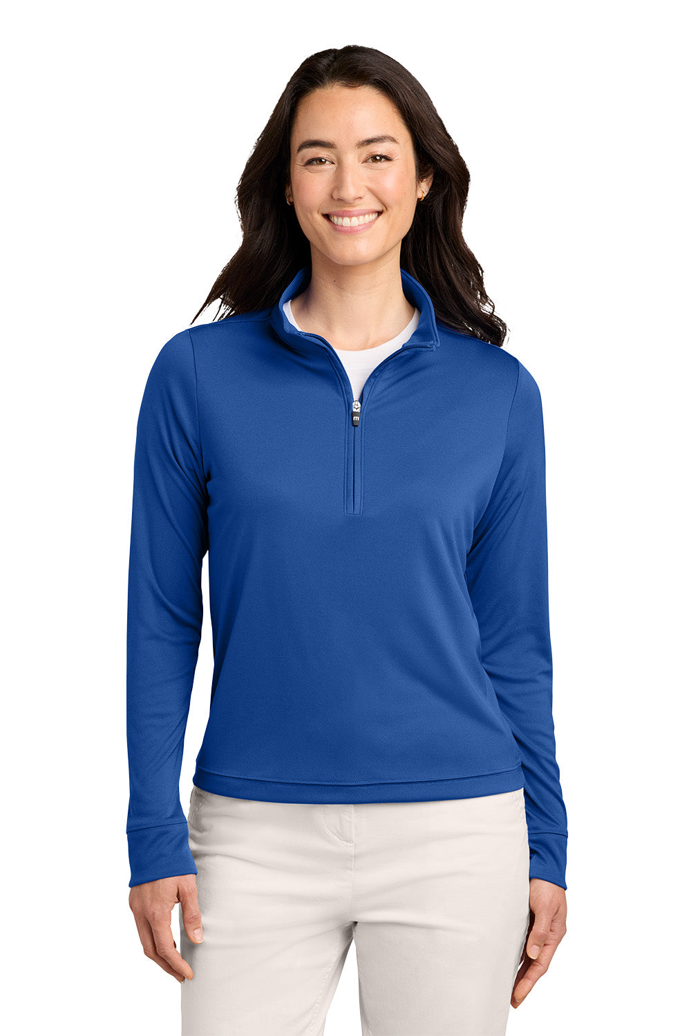 A woman modeling a royal blue long-sleeve quarter-zip pullover against a plain white background. TravisMathew Women's Coto Performance 1/2-Zip, Embroidered