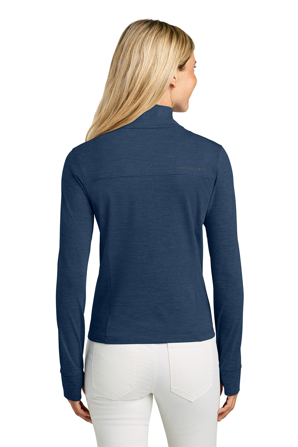 Woman wearing a blue long-sleeve shirt with a visible brand logo on a white background. TravisMathew Women’s Onward 1/2-Zip, Embroidered
