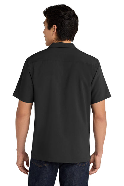 Person wearing a black polo shirt on a white background embroidered Port Authority ® Short Sleeve Performance Staff Shirt