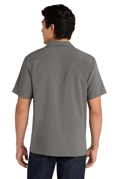 Person wearing a gray short-sleeve shirt on a white background embroidered Port Authority ® Short Sleeve Performance Staff Shirt