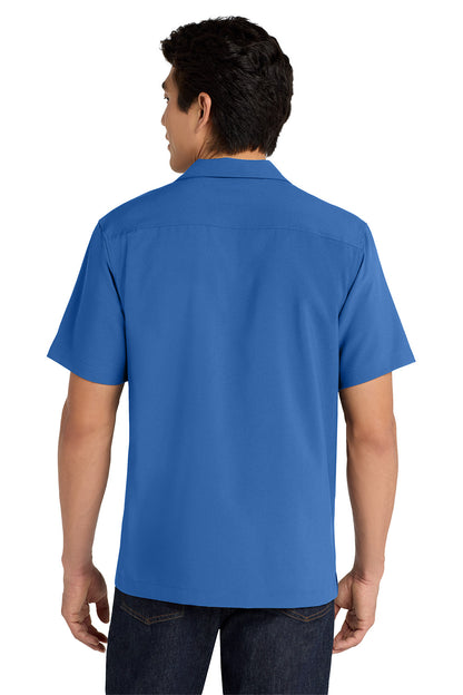 Person wearing a blue polo shirt on a white background embroidered Port Authority ® Short Sleeve Performance Staff Shirt