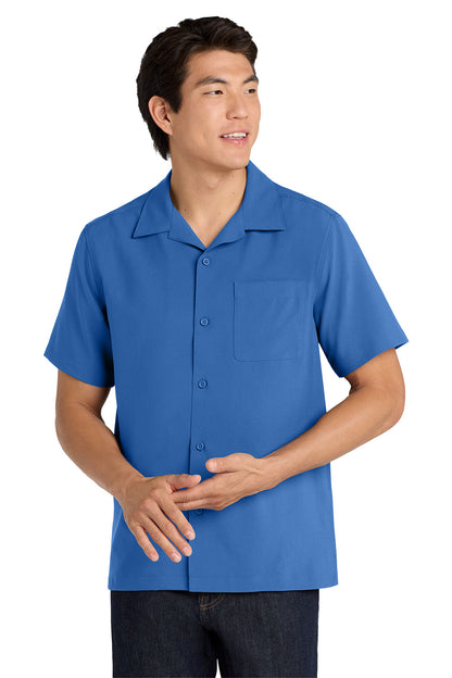 Man wearing a blue short-sleeve shirt on a white background embroidered Port Authority ® Short Sleeve Performance Staff Shirt