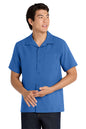 Man wearing a blue short-sleeve shirt on a white background embroidered Port Authority ® Short Sleeve Performance Staff Shirt