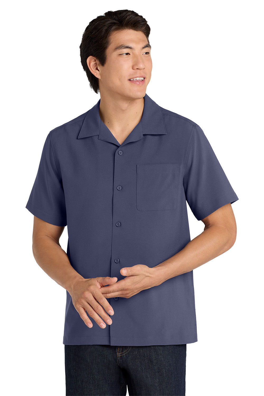 Man wearing a navy blue short-sleeve shirt on a white background embroidered Port Authority ® Short Sleeve Performance Staff Shirt