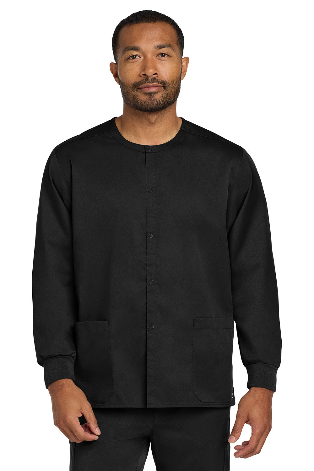 Man wearing a black long-sleeve shirt on a white background Wink® Unisex WorkFlex Snap-Front Scrub Jacket, Embroidered