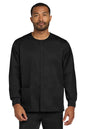 Man wearing a black long-sleeve shirt on a white background Wink® Unisex WorkFlex Snap-Front Scrub Jacket, Embroidered