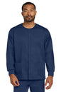 Man wearing a navy blue scrub top on a white background Wink® Unisex WorkFlex Snap-Front Scrub Jacket, Embroidered