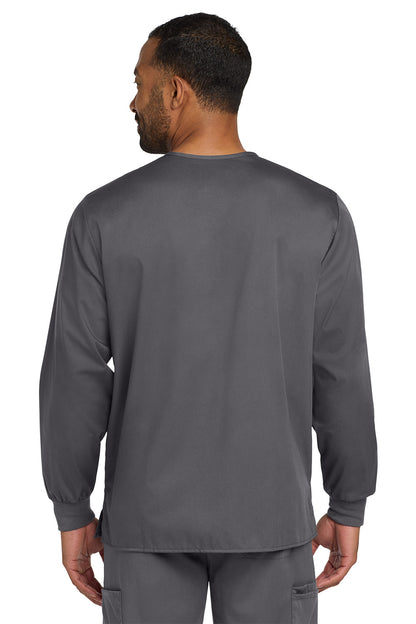 Man wearing a gray long-sleeve shirt on a white background Wink® Unisex WorkFlex Snap-Front Scrub Jacket, Embroidered