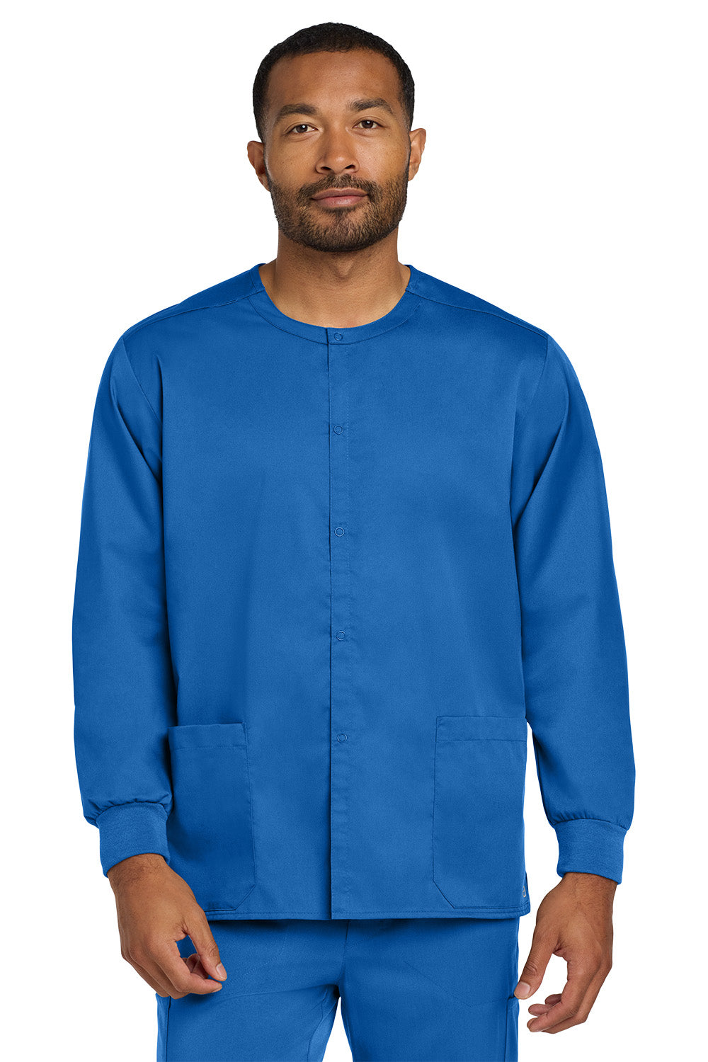 Man wearing a blue scrub set on a white background Wink® Unisex WorkFlex Snap-Front Scrub Jacket, Embroidered
