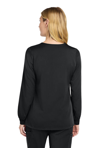 Person wearing a black long-sleeve shirt on a white background Wink® Women’s Premiere Flex™ Full-Zip Scrub Jacket, Embroidered