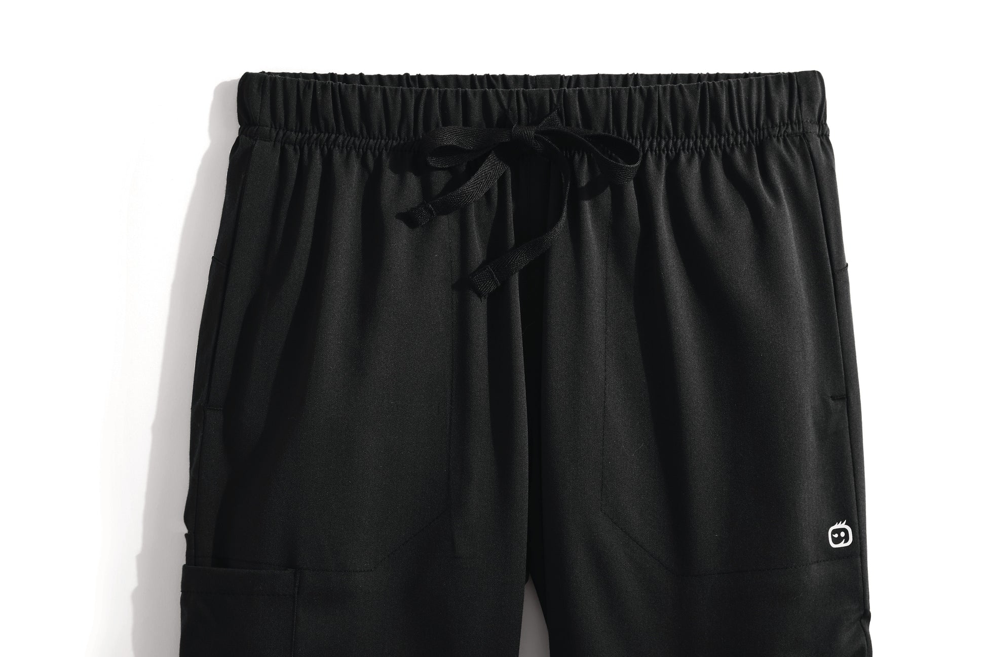 Black pants with a drawstring on a white background Wink® Women’s Premier Flex Cargo Pant