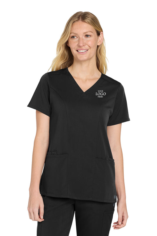 Woman wearing a black scrub top with a logo on a white background Wink® Women’s Premiere Flex™ Top, Embroidered