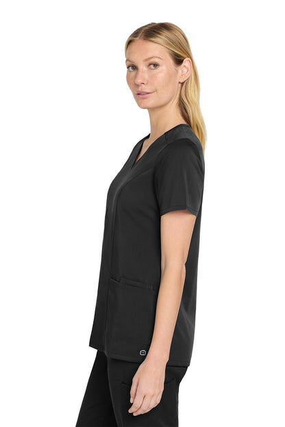 Woman wearing a black scrub top on a white background Wink® Women’s Premiere Flex™ Top, Embroidered