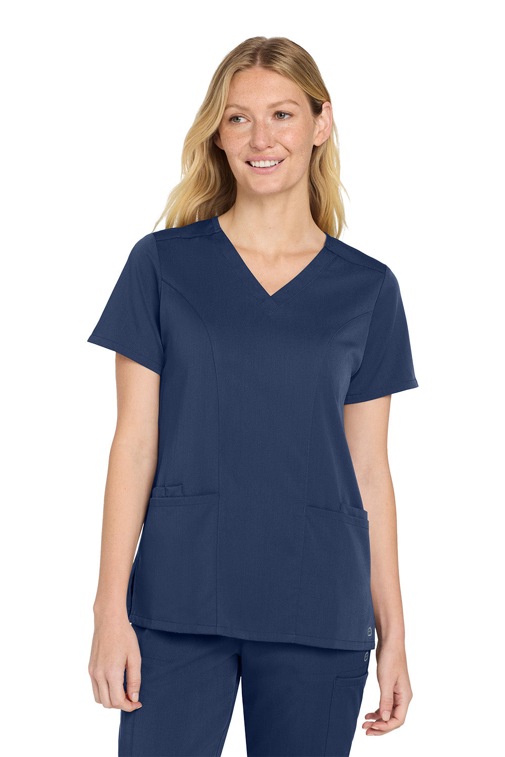 Woman wearing a navy blue scrub top and pants on a white background Wink® Women’s Premiere Flex™ Top, Embroidered