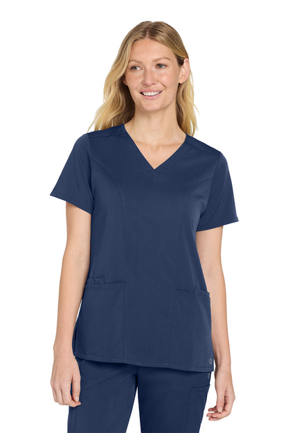Woman wearing a navy blue scrub top and pants on a white background Wink® Women’s Premiere Flex™ Top, Embroidered