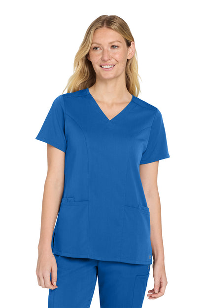 Woman wearing a blue scrub top and pants on a white background Wink® Women’s Premiere Flex™ Top, Embroidered