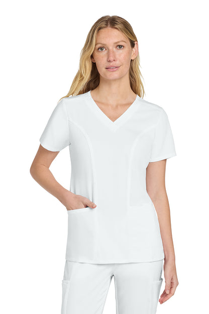 Woman wearing a white scrub top and pants on a white background Wink® Women’s Premiere Flex™ Top, Embroidered