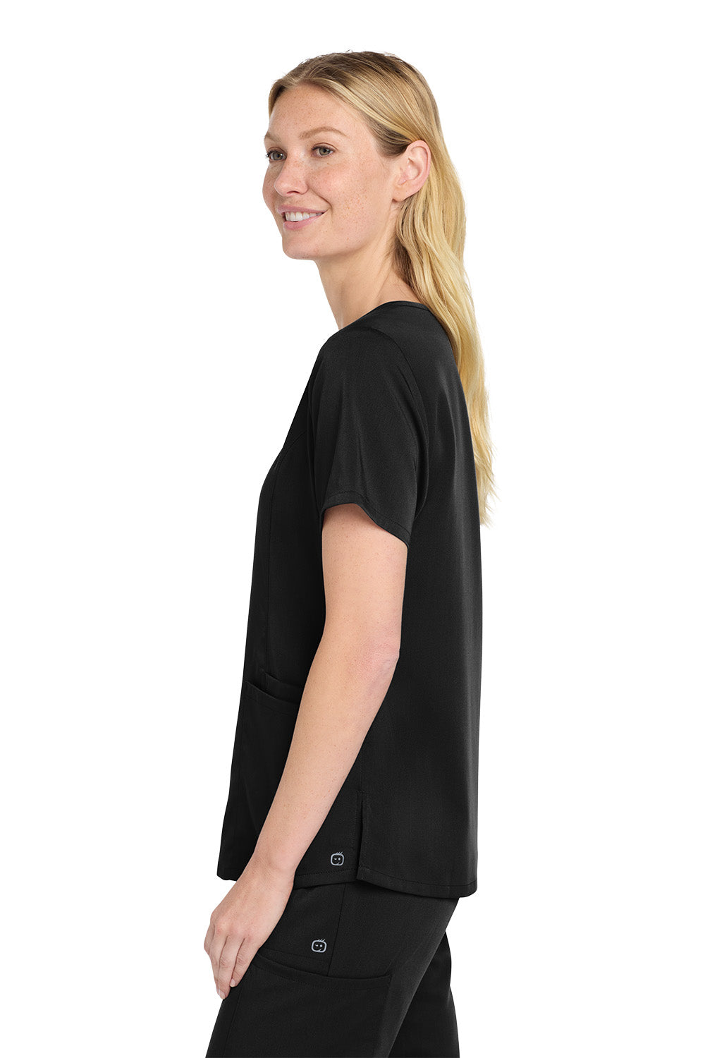 Woman wearing a black outfit on a white background Wink® Women’s Premiere Flex™ Top, Embroidered