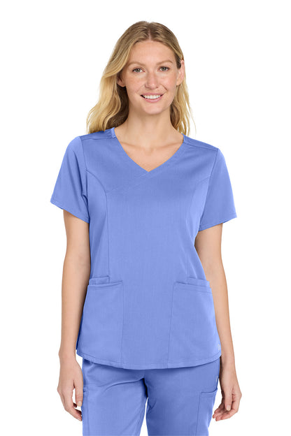 Woman wearing a blue scrub top and pants on a white background Wink® Women’s Premiere Flex™ Top, Embroidered