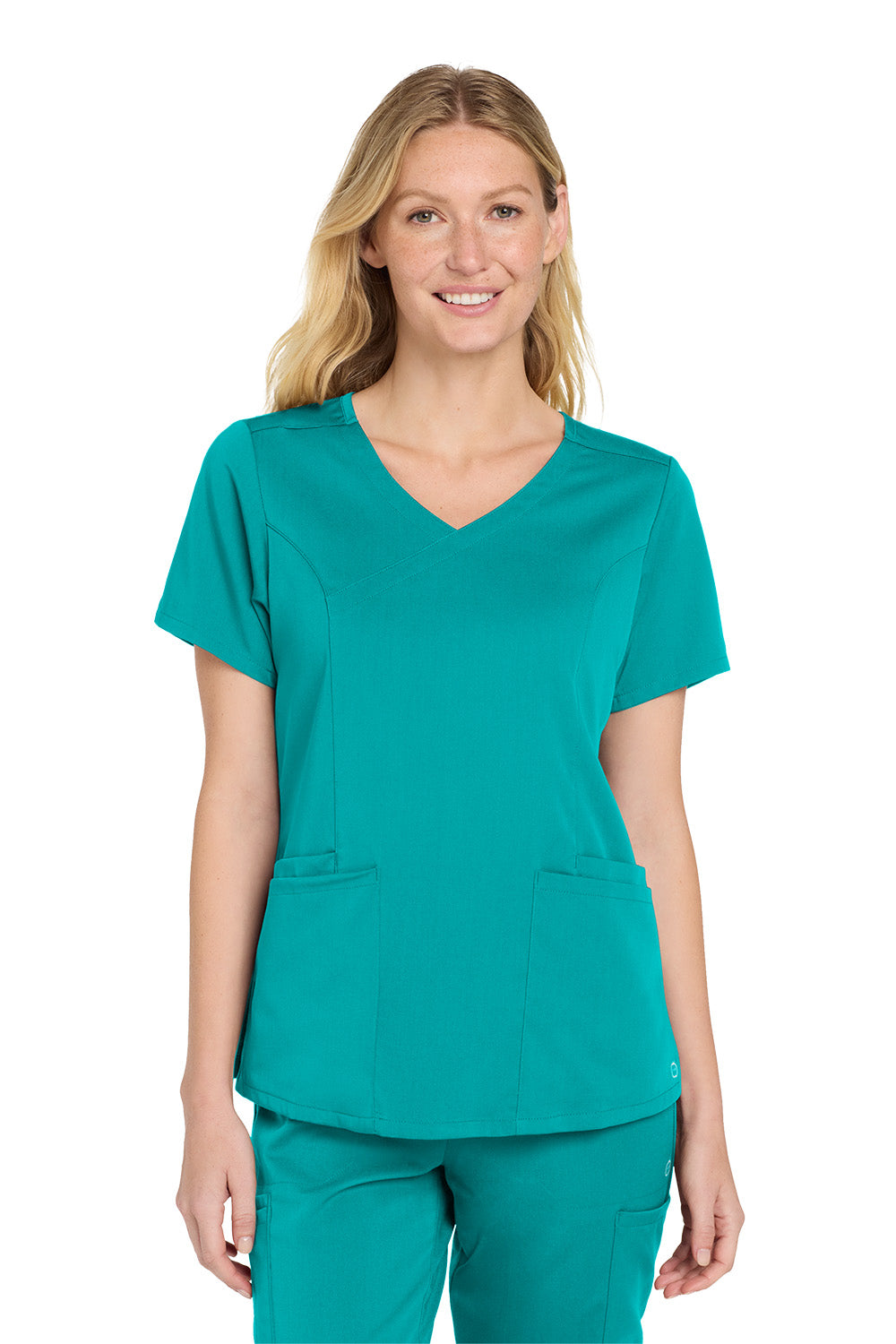 Woman wearing a teal scrub top and pants on a white background Wink® Women’s Premiere Flex™ Top, Embroidered