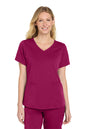 Woman wearing a magenta scrub top and pants on a white background Wink® Women’s Premiere Flex™ Top, Embroidered