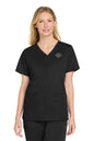 Woman wearing a black scrub top with a logo on a white background embroidered Wink® Women’s WorkFlex V-Neck Top