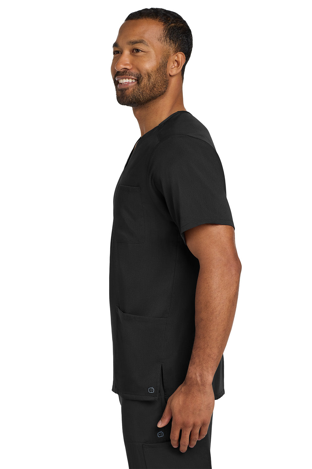 Man wearing a black scrub set on a white background Wink® Men's Premiere Flex™ V-Neck Top
