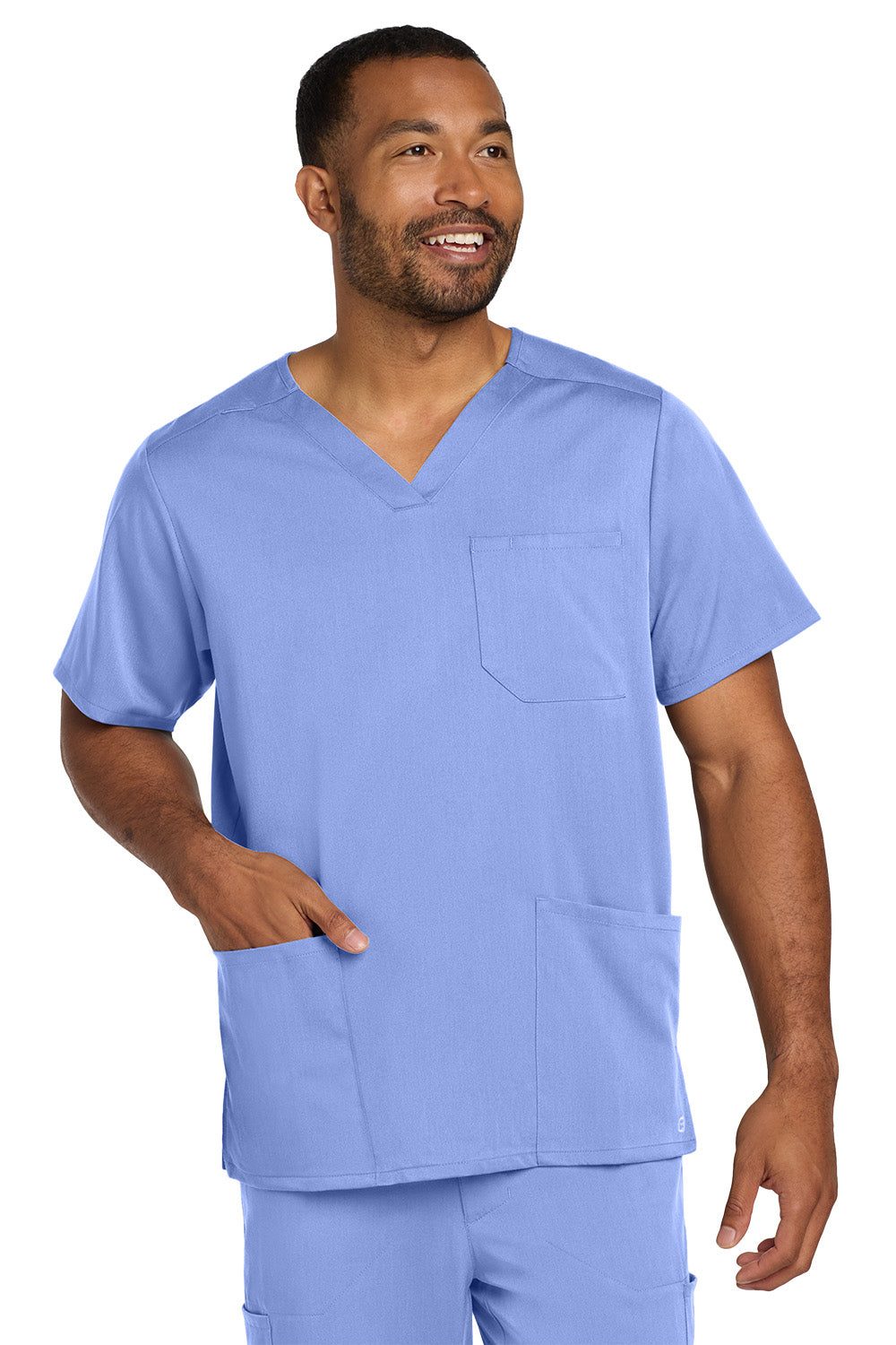 Man wearing a blue scrub set on a white background Wink® Men's Premiere Flex™ V-Neck Top