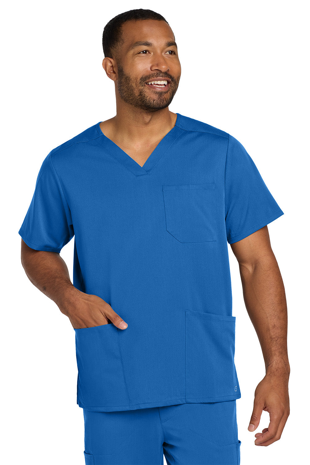 Man wearing a blue scrub set on a white background Wink® Men's Premiere Flex™ V-Neck Top