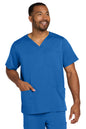 Man wearing a blue scrub set on a white background Wink® Men's Premiere Flex™ V-Neck Top