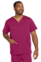 Man wearing a magenta scrub set on a white background Wink® Men's Premiere Flex™ V-Neck Top
