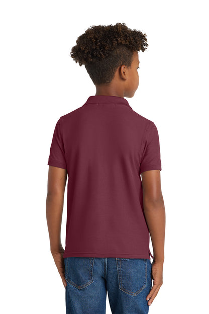 Child wearing a maroon polo shirt on a white background. Port Authority® Youth Core Classic Pique Polo, Embroidered by Helmsman Stitch Co.