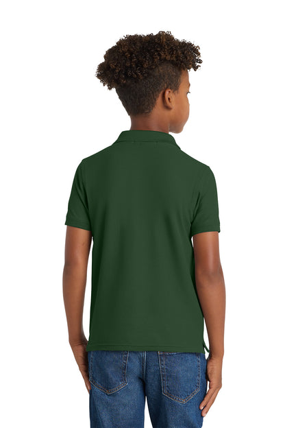 Child wearing a green polo shirt on a white background. Port Authority® Youth Core Classic Pique Polo, Embroidered by Helmsman Stitch Co.