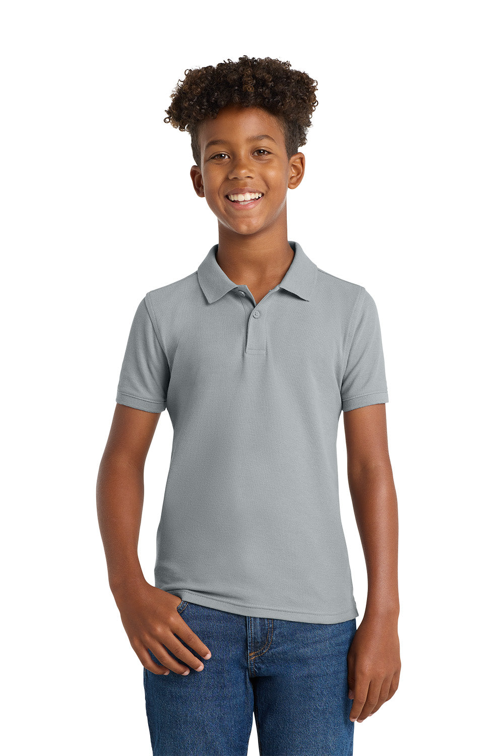 Young person wearing a gray polo shirt and blue jeans on a white background. Port Authority® Youth Core Classic Pique Polo, Embroidered by Helmsman Stitch Co.