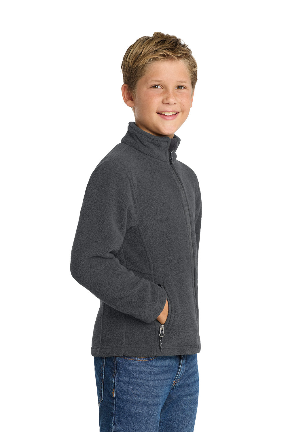 Young boy wearing a gray fleece jacket on a white background. Port Authority® Youth Value Fleece Jacket, Embroidered by Helmsman Stitch Co.